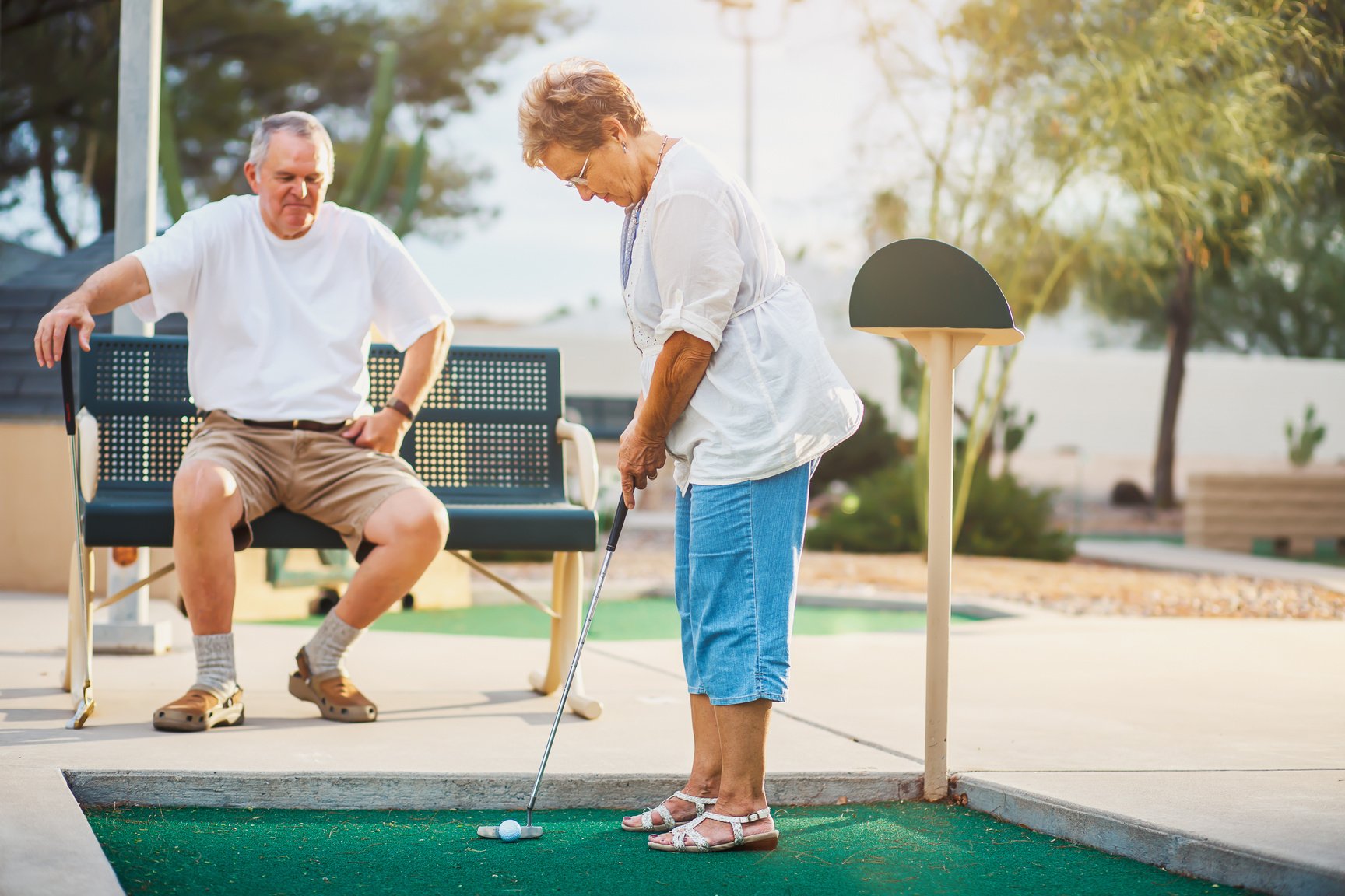 Senior Couple Playing Golf